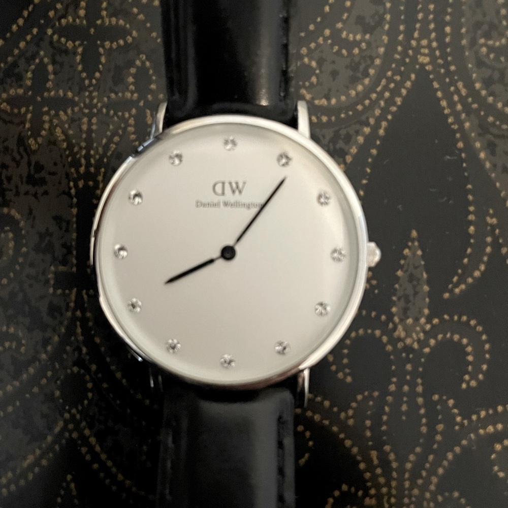 Daniel Wellington black wristband watch.